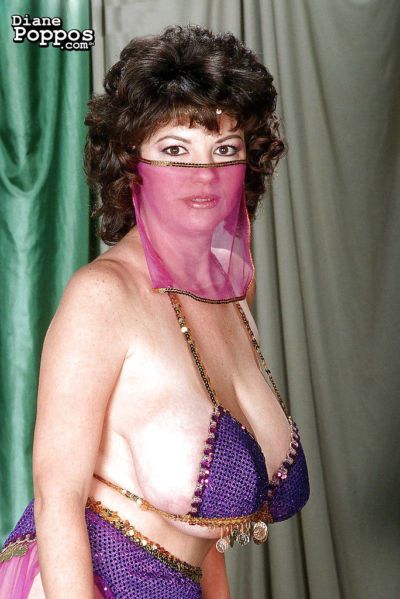 Mature Greek woman Diane Poppos letting big hanging tits fall free