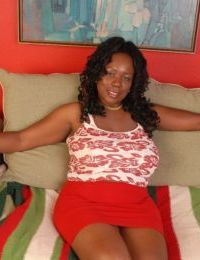 Fatty ebony Yvette shows her awesome big natural boobies on sofa