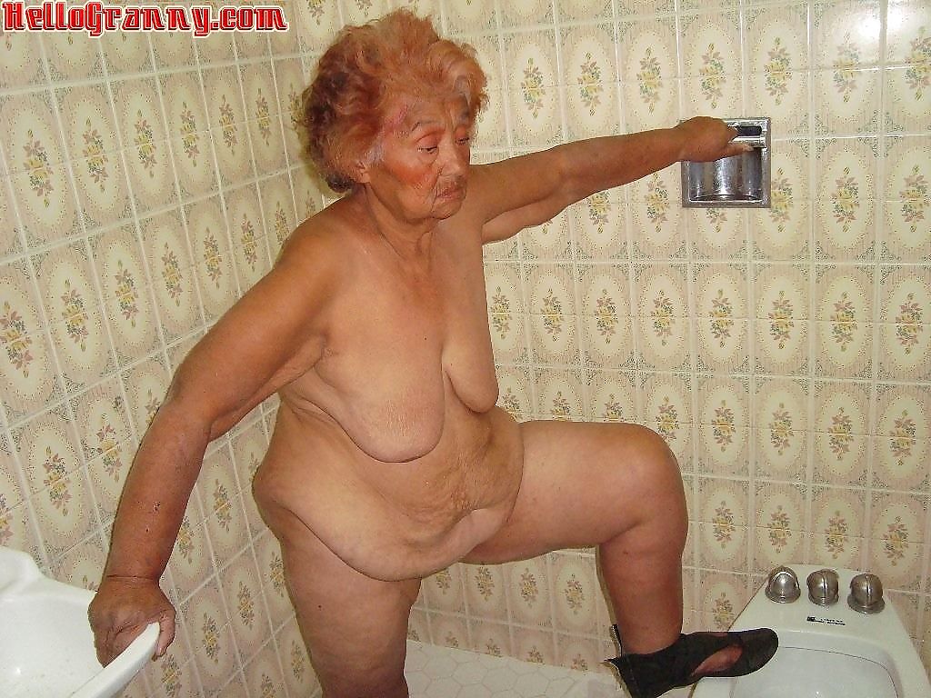 Painted granny in the shower plays with her boobs - part 3891