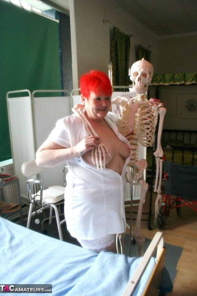 Slutty mature nurse in white stockings gets toyed up by a skeleton