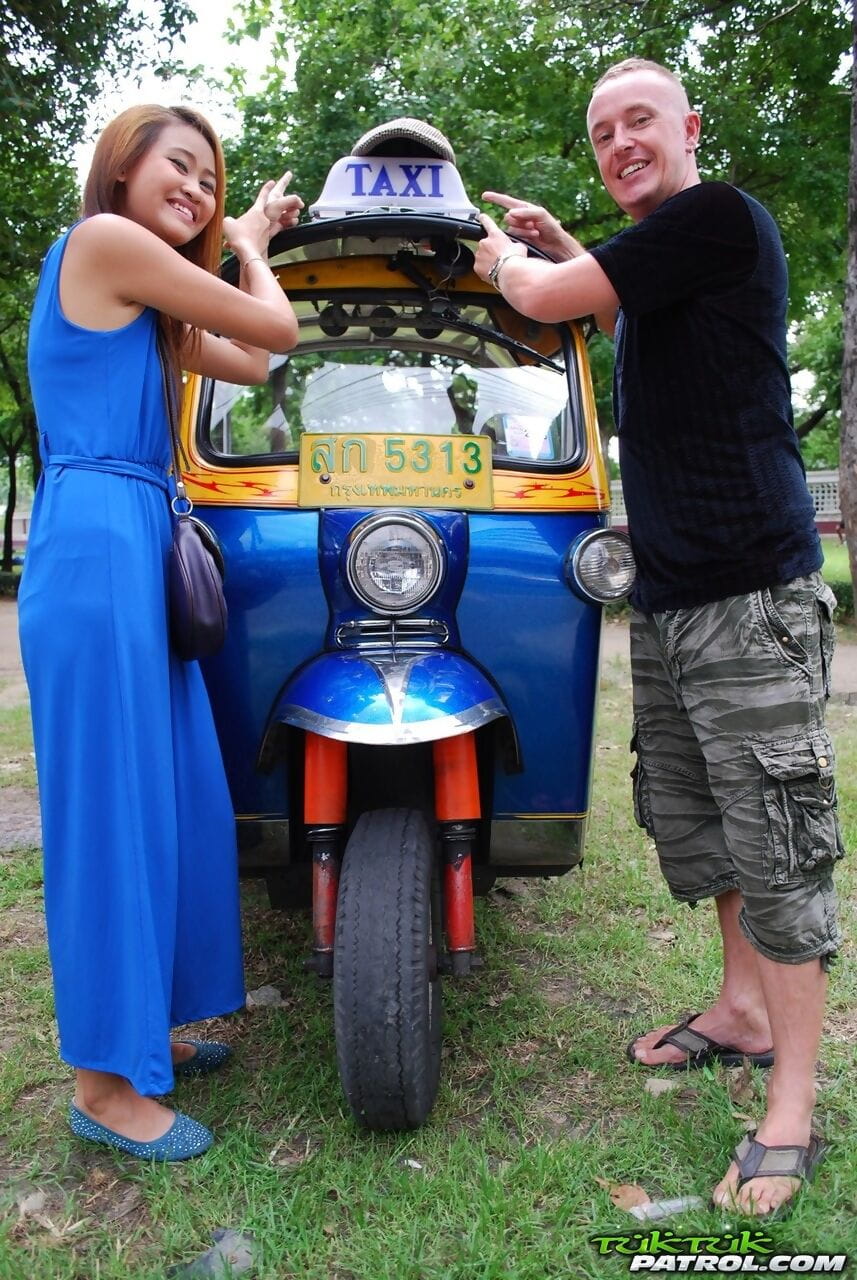 Beautiful Thai girl Mon flirting with a cute male tourist in public