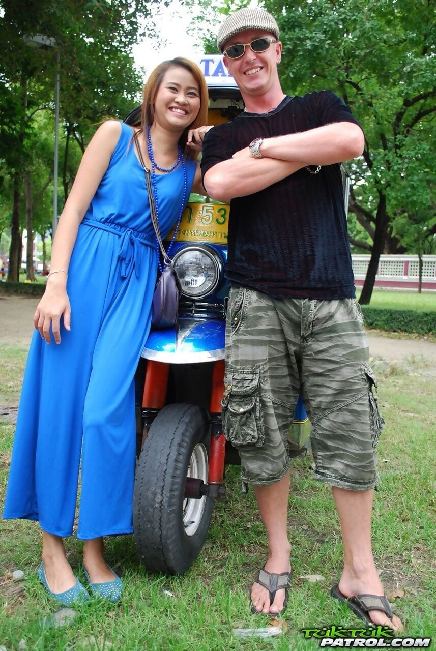 Beautiful Thai girl Mon flirting with a cute male tourist in public