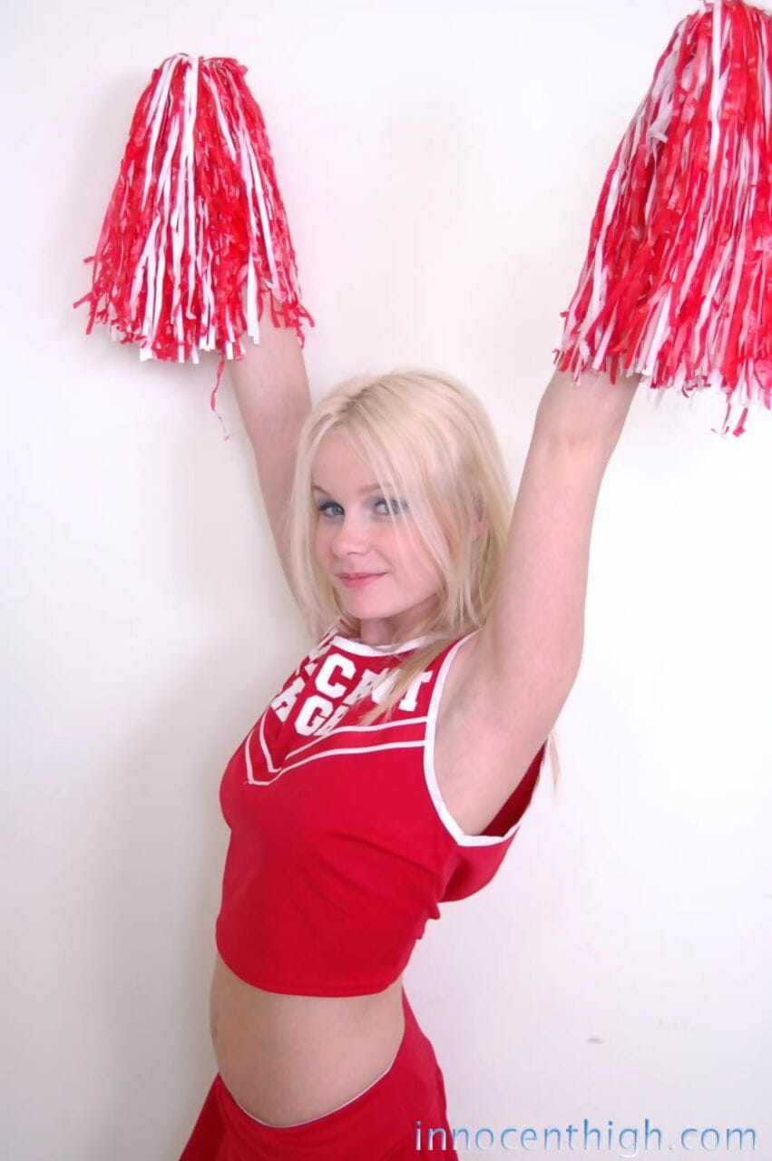 Cute blonde cheerleader Kylee Crista teasing with shaved pussy and hot ass