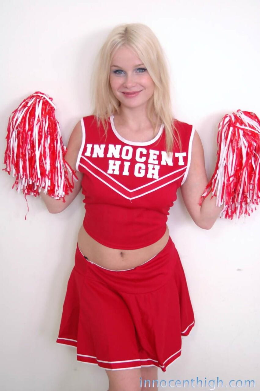 Cute blonde cheerleader Kylee Crista teasing with shaved pussy and hot ass