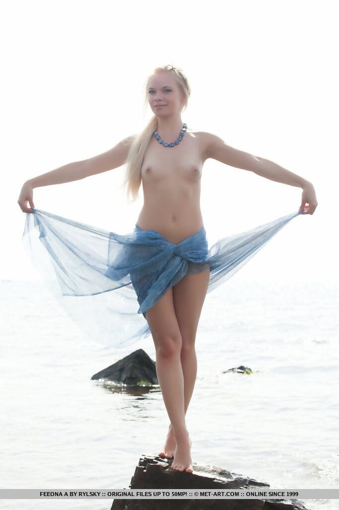 Blonde hot teen Feeona A posing on beach showing tiny titties & shaved pussy