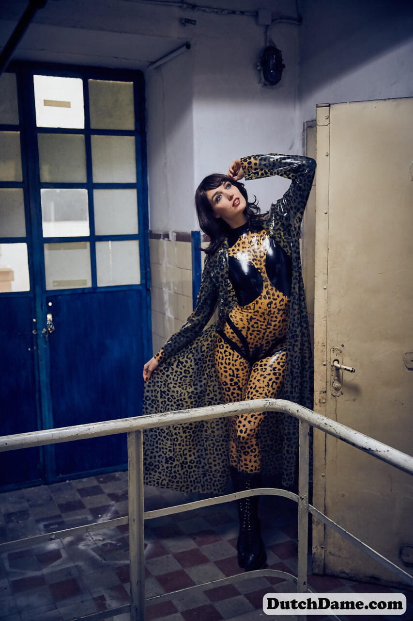 Solo model strikes hot poses in full body leopard print costume