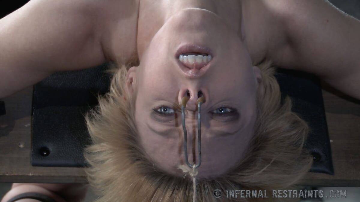Blonde female Darling is subjected to anal penetration while in bondage
