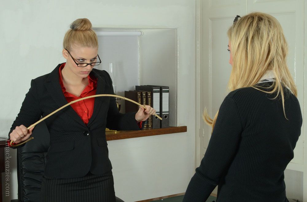 Tough teacher in glasses punishes her nasty female student by ass spanking