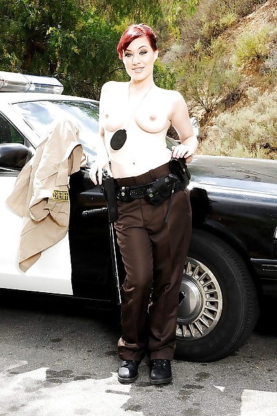 Redhead pornstar babe Jessica Ryan strips off police uniform outdoors