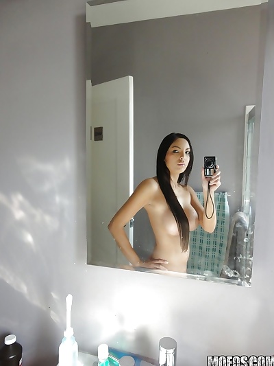 Latina brunette Danni Cole dose self shots while naked in the bathroom