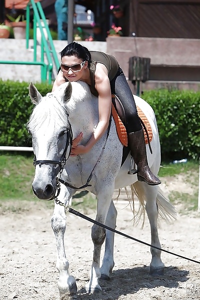 Pornstar Aletta Ocean is riding a horse outdoor in glasses